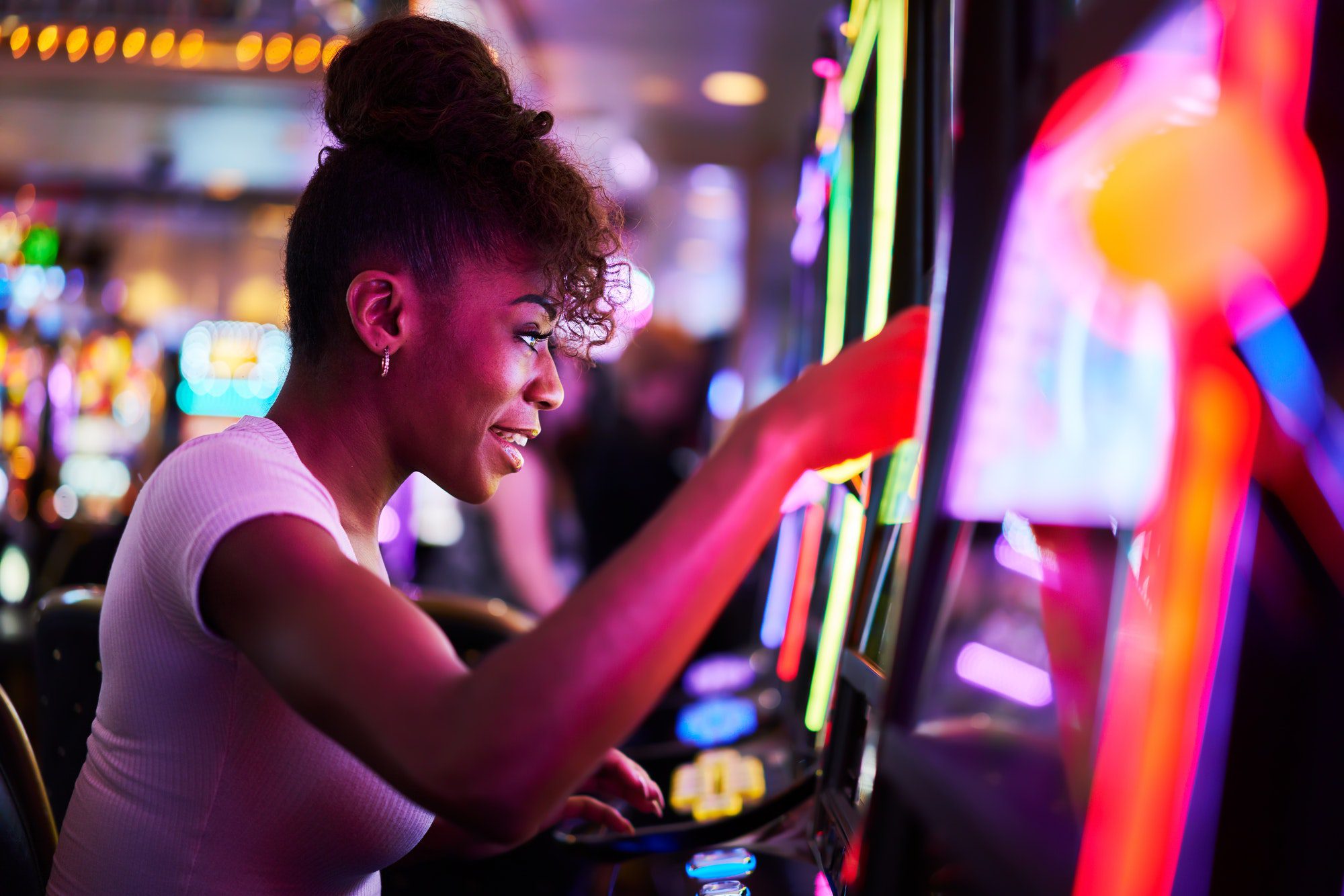 happy-woman-gambling-at-casino-playing-slot-machine-3.jpg